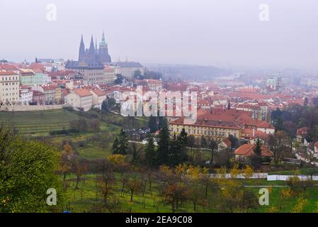 View of Prague from of Strahov Monastery, Castle and Saint Vitus Cathedral on a foggy day. Stock Photo