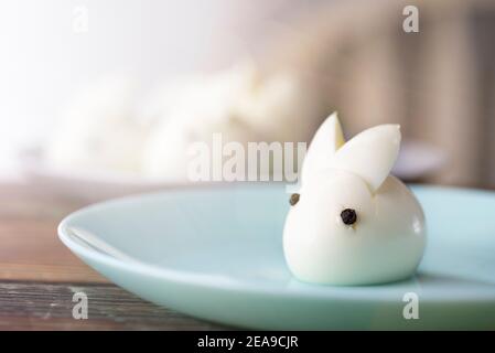 Funny bunny made of boiled eggs, Easter table decoration, Easter decor and serving. Stock Photo