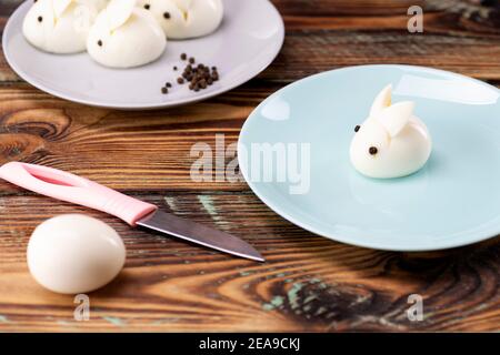 Funny bunny made of boiled eggs, Easter table decoration, Easter decor and serving. Stock Photo