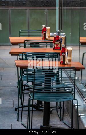 Empty Restaurant Tables in the City of London Financial District. Stock Photo
