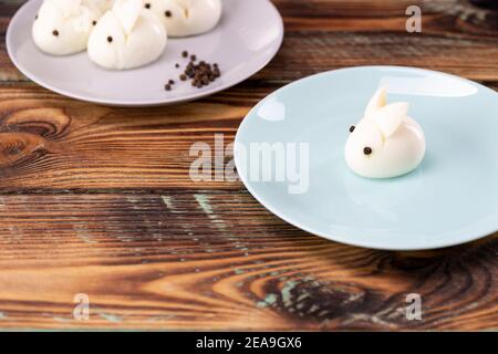 Funny bunny made of boiled eggs, Easter table decoration, Easter decor and serving. Stock Photo