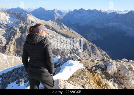 Hike to the Pleisenspitze (2569m), young women, mountain tour, mountain hiking, outdoor, autumn in the Karwendel nature park, view of the Hinterautal Stock Photo