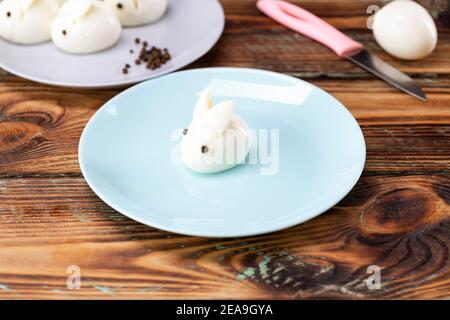 Funny bunny made of boiled eggs, Easter table decoration, Easter decor and serving. Stock Photo