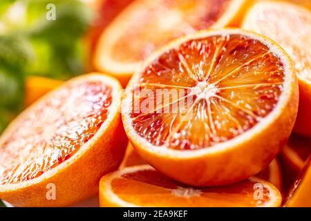 Blood sicilian oranges sliced with fresh melissa - close up Stock Photo