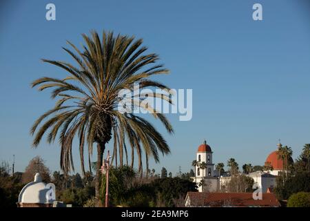 Late afternoon sun shines on the historic Basilica and historic district of San Juan Capistrano, California, USA. Stock Photo