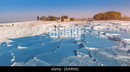 One of the main tourist attractions in Turkey is the travertines and Pamukkale hot springs. Scenic panoramic view on turkish resort Stock Photo