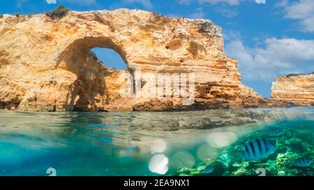 Landscape with natural arch, near Praia da Marinha, one of the most famous place of Portugal, located on the Atlantic coast in Lagoa, Algarve Stock Photo