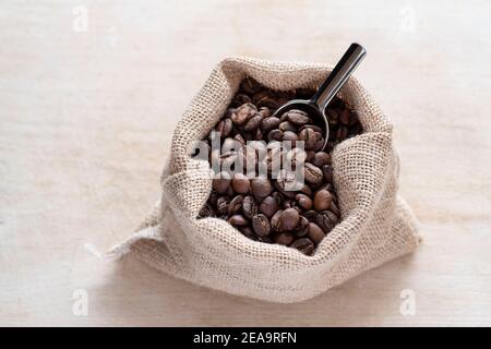 Coffee beans in a rustic jute bag Stock Photo