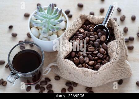 Coffee beans in a rustic jute bag Stock Photo
