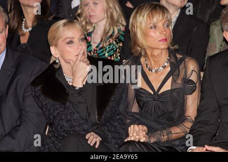 Pianist Helene Mercier Arnault and actress Sharon Stone watch the News  Photo - Getty Images