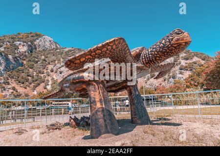 Famous monument to loggerhead Caretta sea turtle laying eggs in the sand on the beach. Dalyan river delta is a nature park for this animals Stock Photo