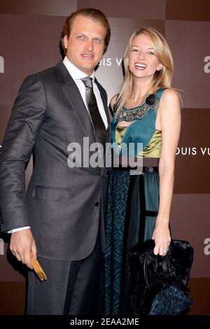 Delphine Arnault with her husband during Louis Vuitton Champs