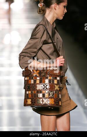 A model displays a creation by U.S. designer Marc Jacobs for French fashion  house Louis Vuitton during the presentation of its Spring-Summer 2006  ready-to-wear collection in Paris, France, on October 9, 2005.