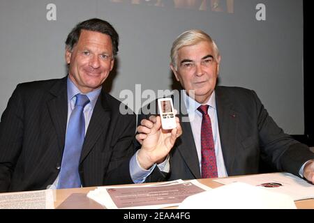 French CEO of NRJ Groupe Jean Paul Baudecroux with French CEO of Credit Mutuel / CIC Michel Lucas attend the launching Press conference of NRJ Mobile (the 4th French Mobile Network in partnership with SFR) at the 'Palais de Tokyo' in Paris, France on october 17, 2005. Photo by Benoit Pinguet/ABACAPRESS.COM Stock Photo