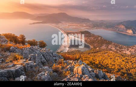 Scenic aerial paniramic view from mountain Bozburun to Iztuzu beach and the Dalyan river Delta as well as lake Sulungur at sunset time. Majestic autum Stock Photo