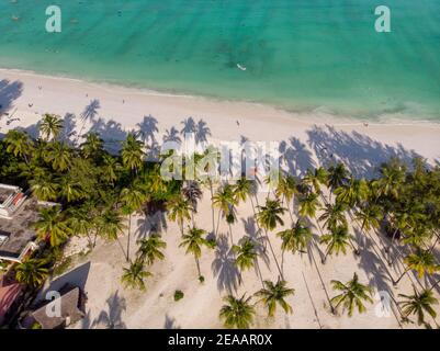 Aerial Top View on Paje Beach With Palm Trees Shadows at Evening Time. Paje village, Zanzibar, Tanzania Stock Photo