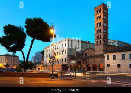 Bell tower of Santa Maria in Cosmedin on the street of Rome Stock Photo