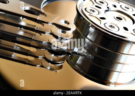 Mirror finish Spindle, Platter and Actuator arm from a modern computer Hard Drive Stock Photo