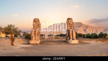 Egypt. Luxor. The Colossi of Memnon - two massive stone statues of Pharaoh Amenhotep Stock Photo