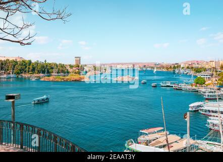 River Nile and boats at sunset in Aswan Stock Photo