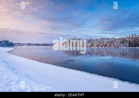 River Pielisjoki flowing through winter landscape, Eastern Finland. Stock Photo