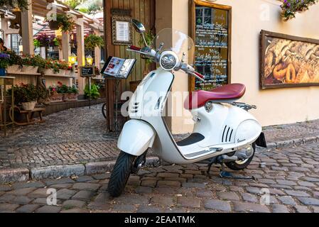 Vintage white scooter parked July 30, 2018 on the street of Prague Stock Photo