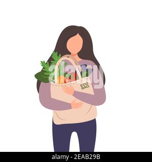 A woman holds a textile bag with vegetables in her hands Stock Vector