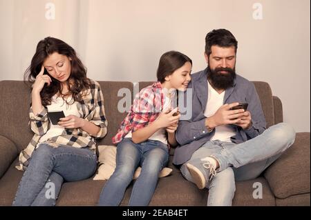 Hooked on Phone. Family Play Mobile Phone Game at Home. Staying Connected  with Cell Phone. Family Communication Stock Photo - Image of beard, baby:  180857330