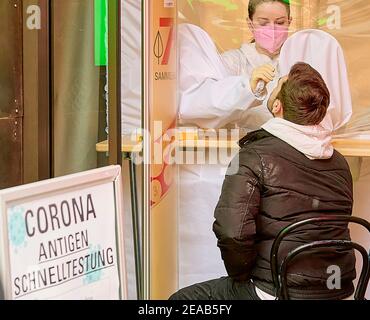 Vienna, Austria. 8th Feb, 2021. A man receives a COVID-19 rapid antigen test at a pharmacy in Vienna, Austria, on Feb. 8, 2021. Around 400 pharmacies across Austria started offering the opportunity to be tested for the coronavirus free of charge using rapid antigen tests on Monday. Credit: Georges Schneider/Xinhua/Alamy Live News Stock Photo