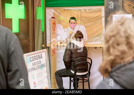 Vienna, Austria. 8th Feb, 2021. A man receives a COVID-19 rapid antigen test at a pharmacy in Vienna, Austria, on Feb. 8, 2021. Around 400 pharmacies across Austria started offering the opportunity to be tested for the coronavirus free of charge using rapid antigen tests on Monday. Credit: Georges Schneider/Xinhua/Alamy Live News Stock Photo