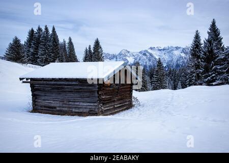 barn in front of the Karwendel Mountains at dawn Stock Photo