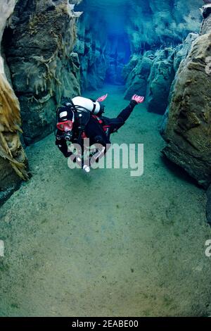 Nesgja, crystal clear freshwater fissure in Nesgja and divers, small tectonic continental fissure between America and Eurasia, Akureyri, northern Iceland Stock Photo