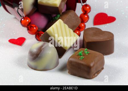 Chocolate Truffle Bucket And Red Hearts On Textured White Stock Photo