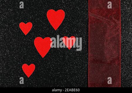 Red Hearts And Ribbon On Black Background Design Stock Photo