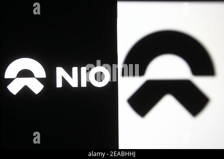Ukraine. 08th Feb, 2021. In this photo illustration a NIO logo of a Chinese car manufacturer is seen on a mobile phone and a pc screen. Credit: SOPA Images Limited/Alamy Live News Stock Photo