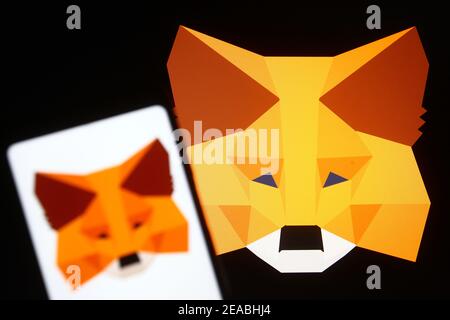 Ukraine. 08th Feb, 2021. In this photo illustration a MetaMask sign of a software cryptocurrency wallet used to interact with the Ethereum blockchain is seen on a mobile phone and a pc screen. Credit: SOPA Images Limited/Alamy Live News Stock Photo