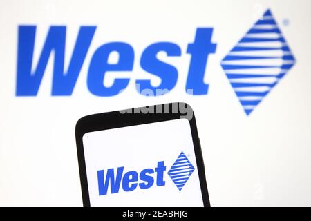 Ukraine. 08th Feb, 2021. In this photo illustration a West Pharmaceutical Services logo seen on a mobile phone and a pc screen. Credit: SOPA Images Limited/Alamy Live News Stock Photo