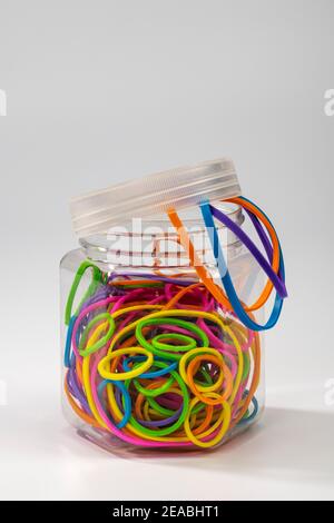 Rubber rings in different sizes and colors in the storage container, Stock Photo