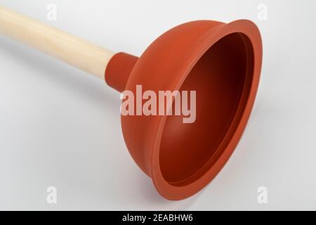 Plumber's drain cleaner tool. Rubber suction cup with wooden handle Stock  Photo - Alamy