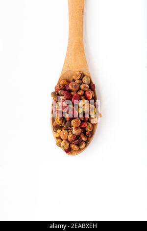 Ground Sumac Powder Spice in wood spoon. Isolated on White Background. Top view. Stock Photo