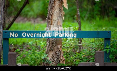 No Overnight Parking sign in a forest car park Stock Photo