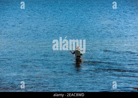 Fly fisherman on a river in Norway Stock Photo