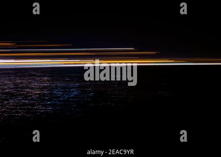 abstract lights in the dark reflected in water Stock Photo