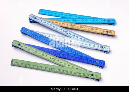Vintage multicolored wooden folding ruler isolated on a white background Stock Photo