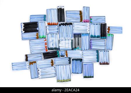 multicolored match sticks in boxes on a white background Stock Photo