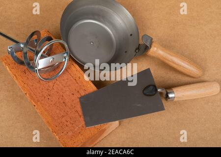 Picture of brick and mason tools on wooden background, top view Stock Photo