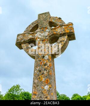 Great Britain, Gloucestershire, Winson near Cirencester, Celtic cross high cross Irish cross grave cross wheel cross in the cemetery at the Church of St. Michael and all Angels. Stock Photo