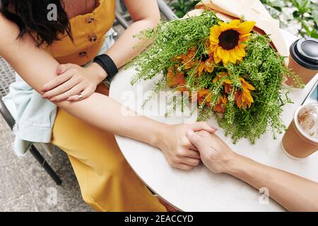 Couple touching hands Stock Photo