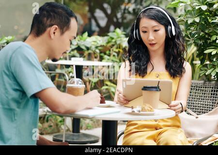 Couple studying in cafe Stock Photo