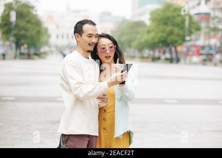 Couple checking application Stock Photo